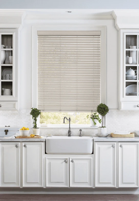 Kitchen with Creamy Window Coverings and Hardwood Floor